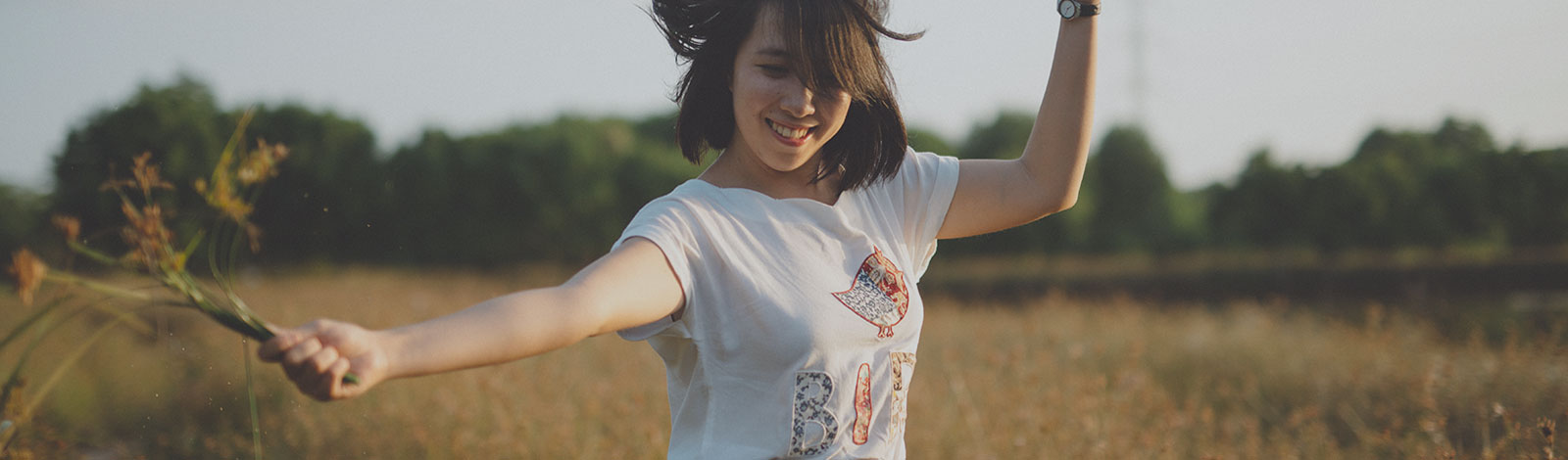 Girl twirling in a corn field